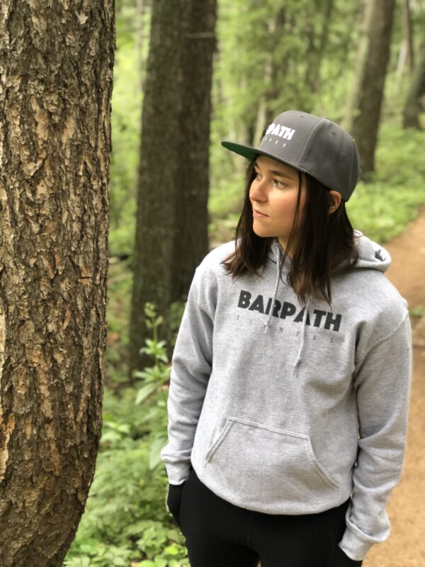 katie wearing a gray barpath fitness hoodie